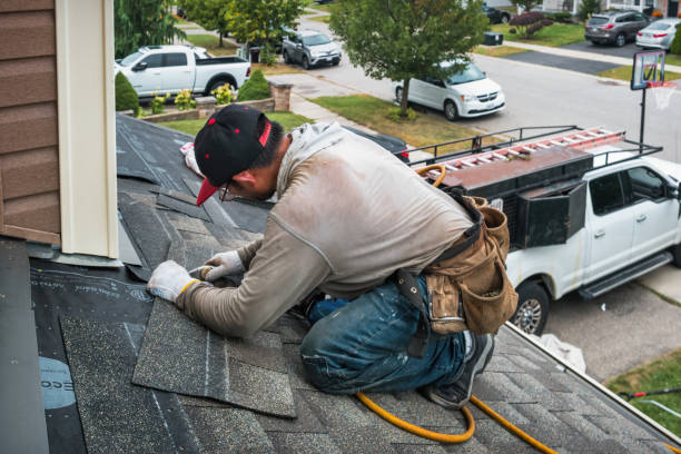Professional Storm Damage Roof Repair technician working in Fate, TX